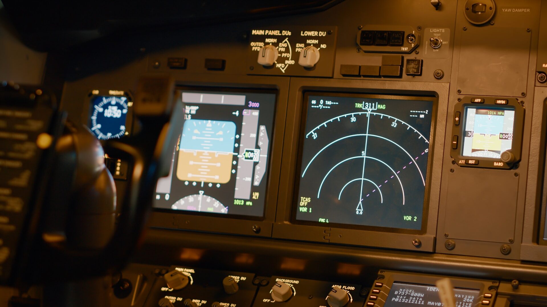 Radar compass and windscreen on dashboard in cockpit