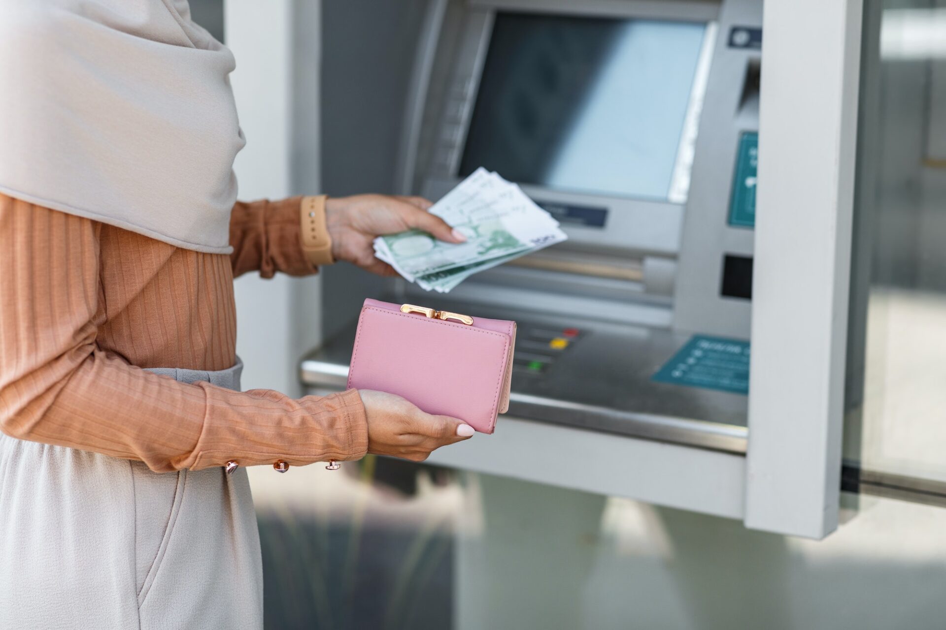 Finance, salary, money transfer at modern ATM outdoor, money withdraw, currency and social
