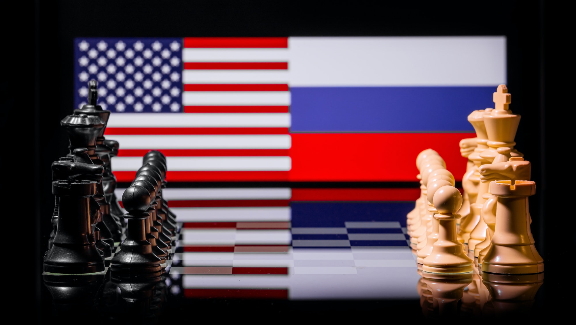 Conceptual image of war between United States and Russia using chess pieces and national flags