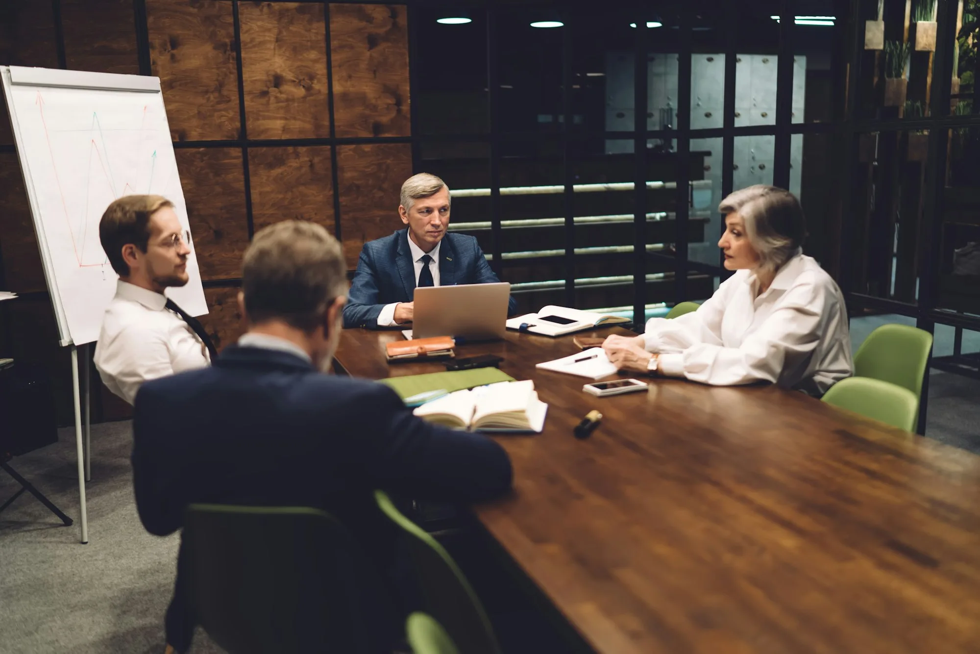 Wistful colleagues having negotiation in conference room